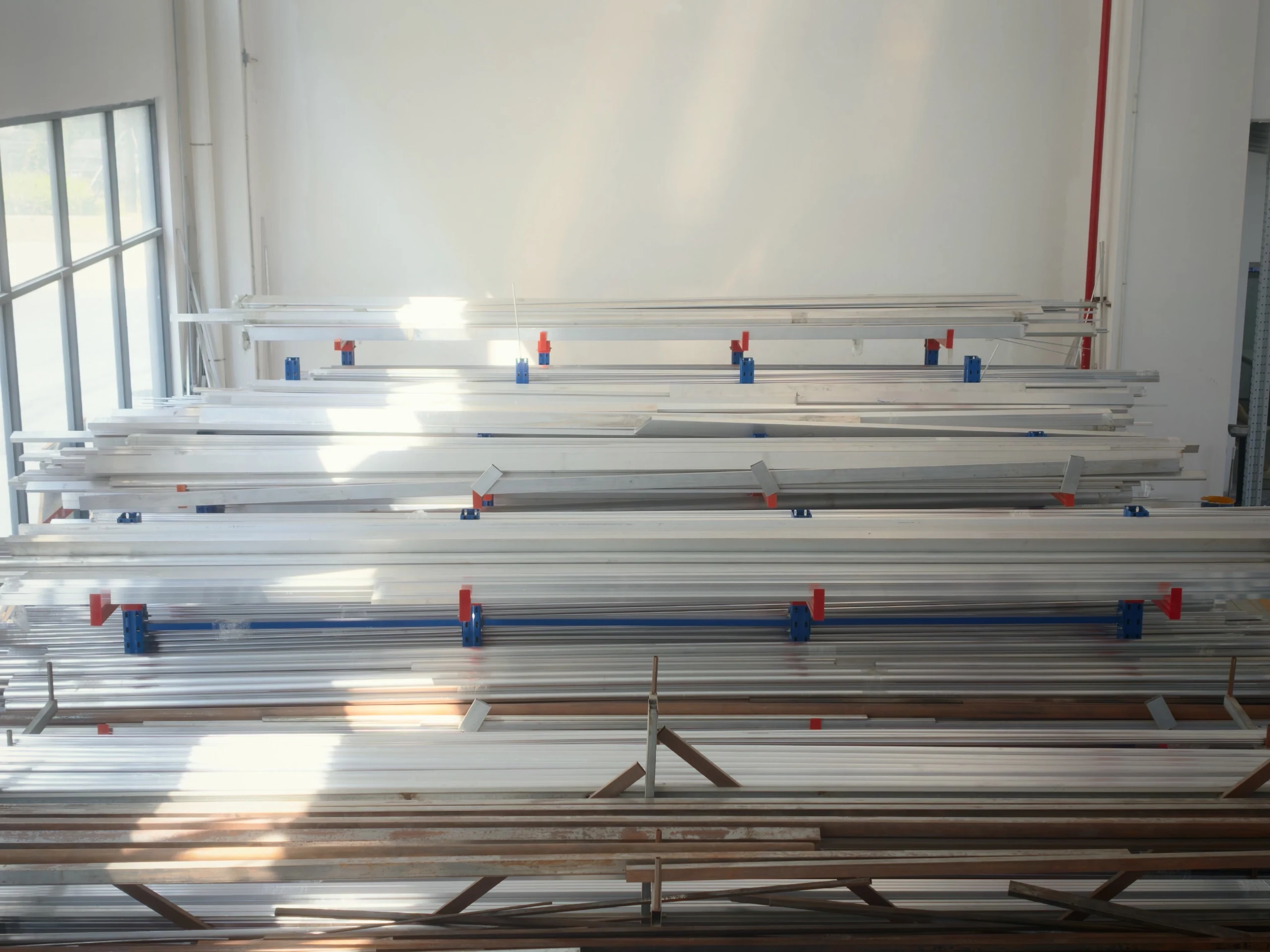 Metal profiles and tubes in the material storage area.