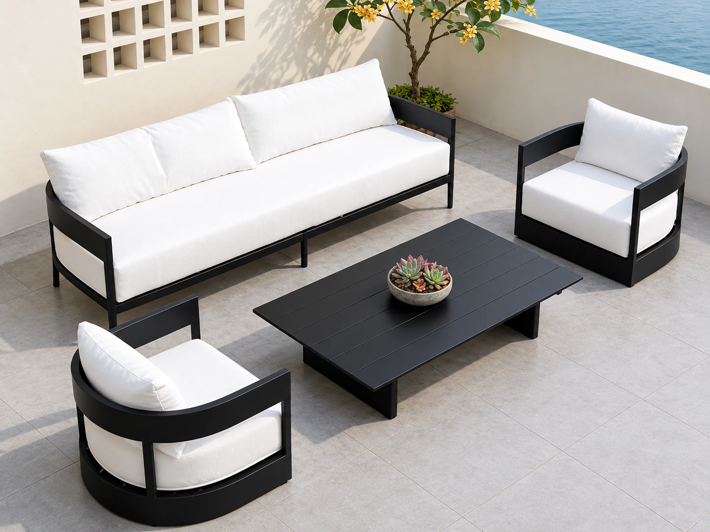 Black-framed outdoor sofa, two armchairs and a rectangular coffee table with white cushions on a terrace